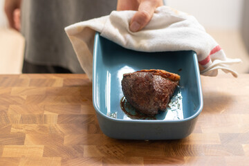 Chef with a plate of picanha