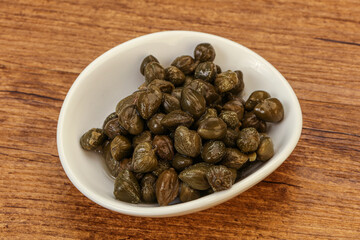 Tasty capers in the bowl