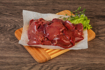 Raw chicken liver over board