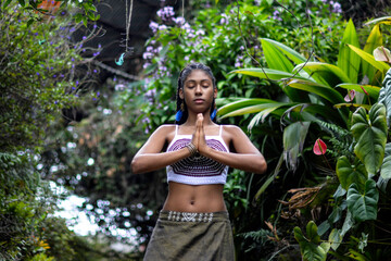 Young afro Colombian with hands in prayer
