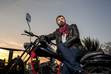 Fototapeta na wymiar man sitting on a motorcycle
