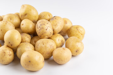 New  raw potatoes isolated on white background close up