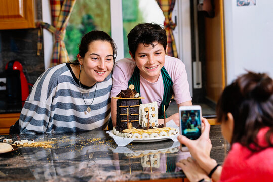 Family funny making chocolate cake at the kitchen