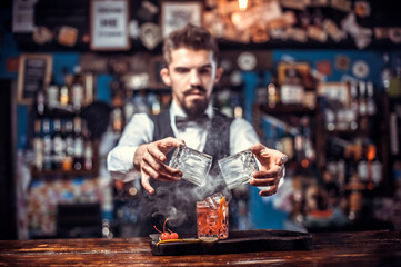Confident bartender decorates colorful concoction in cocktail bars