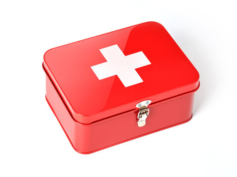 White cross on red aid kit