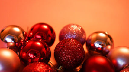 Collection of red Christmas balls on a pink festive background