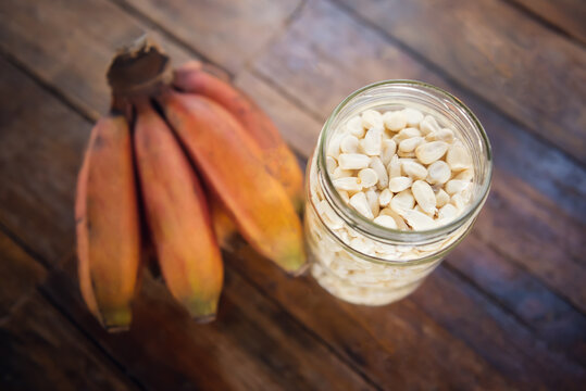 White corn on wooden table. Corn for tortillas on wooden table.
