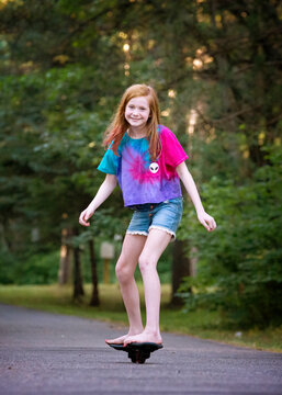 Pre Teen Red Haired Girl Ripsticking