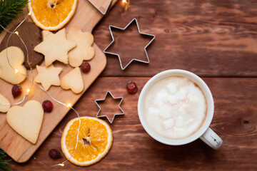 christmas cookies and coffee on the wood background, top view