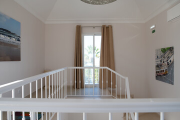 Top floor landing in a Portuguese villa showing stairs and railings
