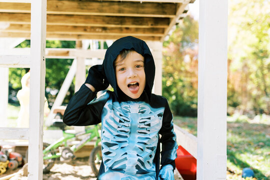 Little boy wearing a skeleton halloween costume