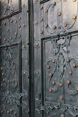 old metal carved door with gold details