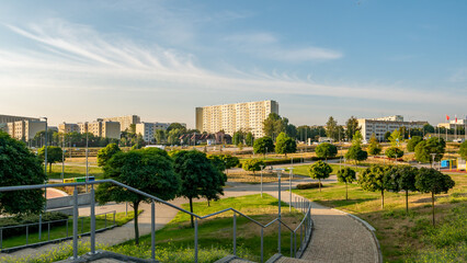 Apartment blocks in the Przymorze district with a green square in front of the hall.