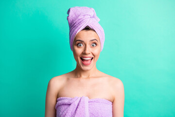 Photo portrait of amazed girl with turban on head after bath wearing pink towel smiling opened mouth isolated bright teal color background