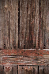 The texture of old barn boards with peeling paint. Old boards for the background. old wood texture for the background.