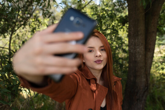 cute red hair girl making a selfie