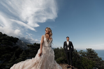 portrait of a happy bride in luxury dress and groom, wedding love emotions