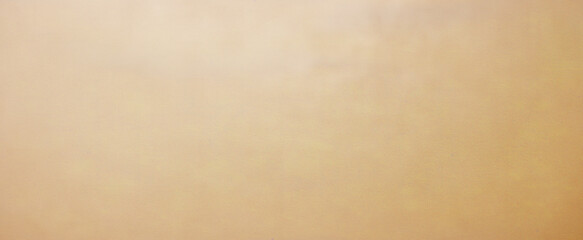 Old brown paper parchment background design with distressed vintage stains and ink spatter and white faded shabby center, elegant antique beige color