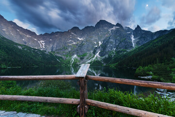 Fototapeta premium summer in the Polish High Tatras with a tourist girl walking near the mountain lakes.