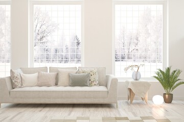 White living room with sofa and winter landscape in window. Scandinavian interior design. 3D illustration