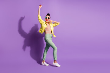 Fototapeta na wymiar Full body photo of young attractive positive smile girl wear casual outfit go walk happy smile enjoy isolated over purple color background