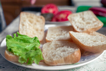 Fresh sliced bread on a plate. Preparing to make sandwiches