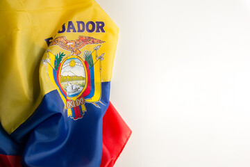 ecuadorian flag wrinkled on a white background on the left diagonal side