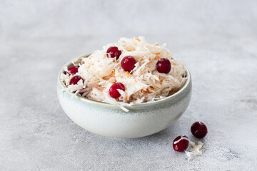 Homemade Traditional sauerkraut with carrots and cranberries.Vegan salad 