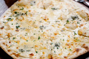 Flatbread with greens and herbs. Traditional caucasus and Turkish bread. Asian flatbreads with cheese and herbs