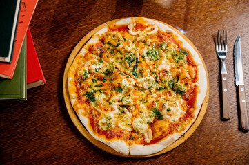 Delicious Shrimp pizza on wood table