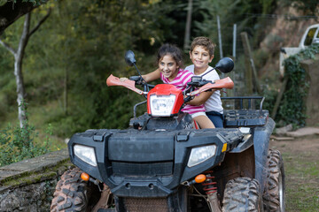 Two little kids riding a quad © Victor