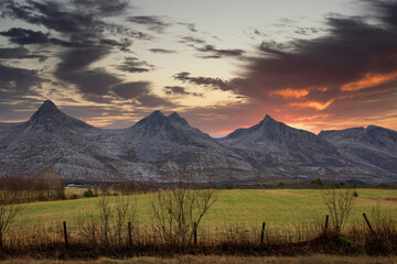 Fototapeta premium Sunset in the mountains seven sisters ( here three of the sisters )in Alstadhaug municipality,Helgeland,Nordland ,Norway,scandinavia,Europe