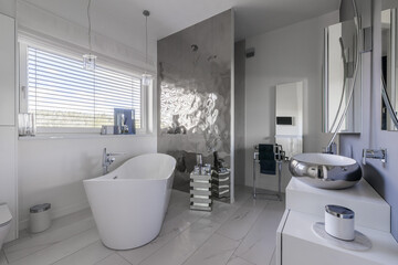 Fototapeta na wymiar Glamor bathroom interior with trendy grey design with white furniture
