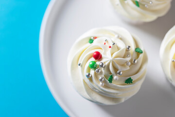 Homemade christmas cupcakes with different decorations. New year food concept.