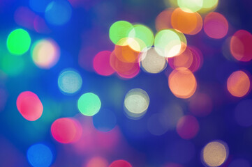 Obraz premium Blurred lights of glowing Christmas garland background