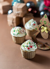 Homemade christmas cupcakes with different decorations. New year food concept.