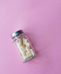 transparent jar with drug capsules

