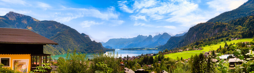 Fototapeta na wymiar Wolfgangsee lake view, Sankt Gilgen, Austria. Picturesque landscape of Alpine lake, village and mountains