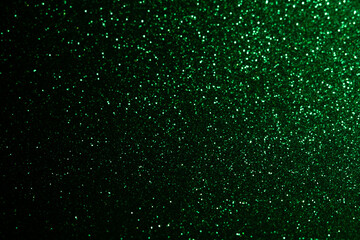 Abstract bokeh dark green with light background.Green x mas color night light elegance,smooth backdrop,artwork design for new year,Christmas sparkling glittering or special day.Selective focus image.