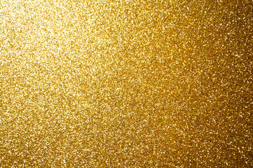 Abstract bokeh gold color with light background.Dark gold color night light elegance,smooth backdrop,artwork design for new year,Christmas sparkling glittering or special day.Selective focus image..