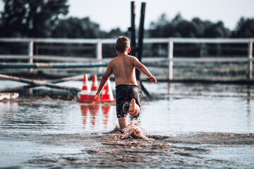 child running in water