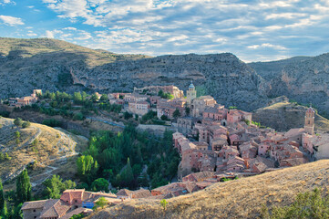 Fototapeta na wymiar The beautiful town of Albarracin seen from the top of its medieval walls and gorge of the river Guadalaviar, Teruel, Spain
