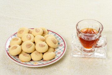 Graibe arabian biscuit with a cup of tea next to it