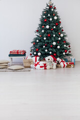 New Year's card interior of the white room red decor and Christmas tree with gifts
