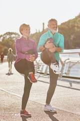 Healthy body. Full length shot of mature man and woman in sportswear smiling, stretching legs while warming up together outdoors in the morning