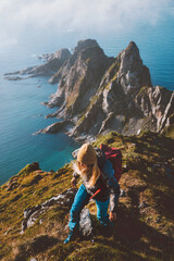 Active woman hiking in Norway travel with backpack trail running outdoor aerial ocean view solo trip healthy lifestyle hobby activity