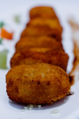closeup of a tray of gourmet croquettes
