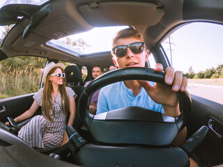 group of friends in car
