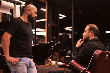 Brutal barber shaves a man in a barbershop