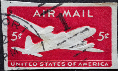 USA - Circa 1946 : a postage stamp printed in the US showing the DC-4 Skymaster on the Airmail...